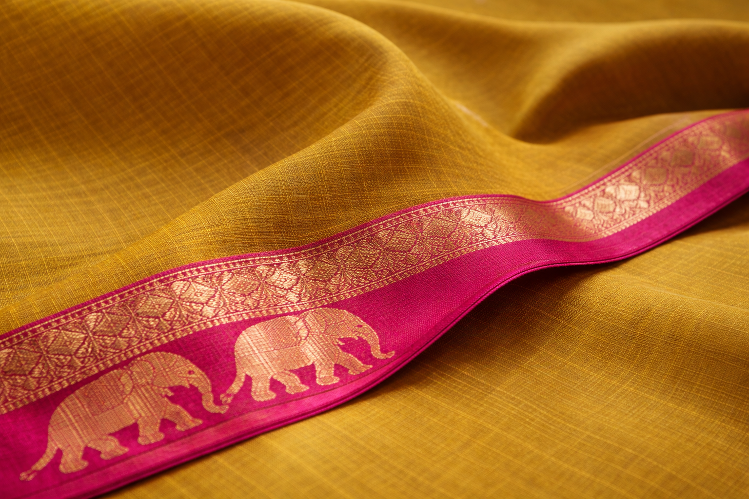 mustard yellow saree with golden elephants